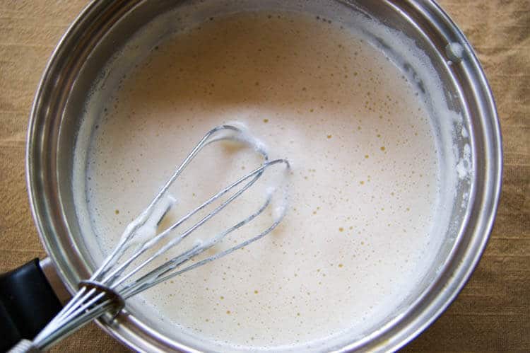 How to Make Sweetened Condensed Milk -Making your own sweetened condensed milk is as easy as blending three ingredients together in a saucepan. Read how you can swap to use natural sweeteners such as honey and coconut sugar and find out what the secret ingredient is that makes this so creamy and rich! Check out this easy 3-ingredient tutorial on how to make sweetened condensed milk! #condensedmilk #homemade