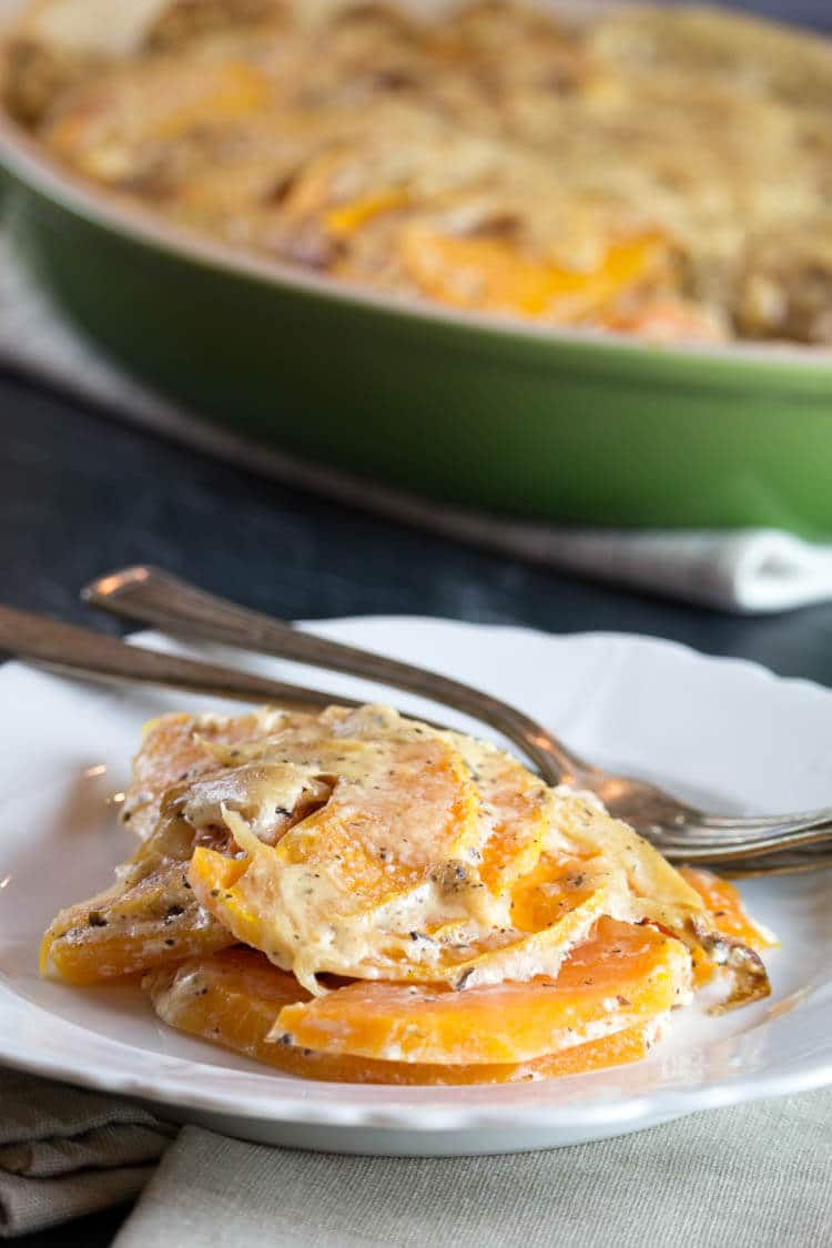Scalloped Butternut Squash with Caramelized Onions -Thinly sliced butternut squash is enveloped in a sea of caramelized onions and garlicky cream sauce. This side dish is loaded with amazing aroma and delicious flavors. #glutenfree #realfood #holidays 