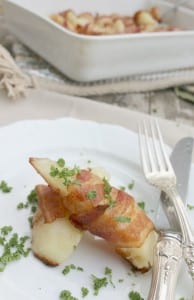 Bacon Wrapped Potato Wedges - this 2-ingredient dish will be a hit at your table. There is a trick to making the potatoes tender and tasty, click to find out what it is!