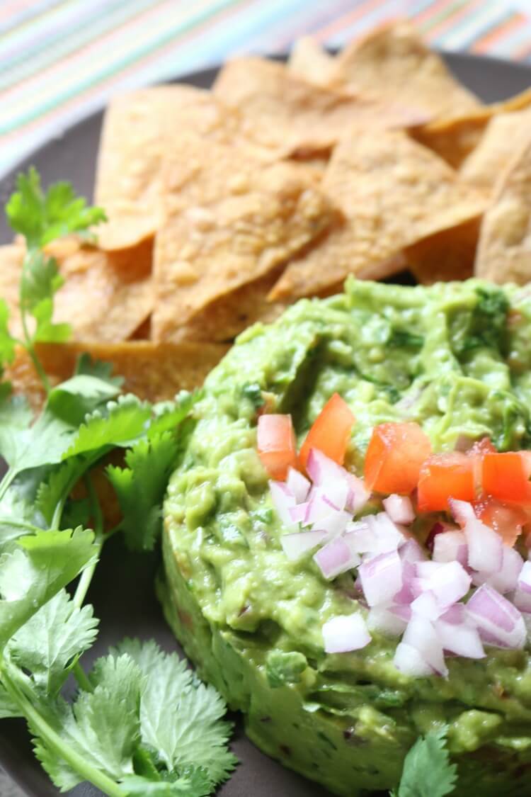 Chunky Guacamole is full of delicious flavors and textures. It's naturally gluten free and is a great dip for Paleo, GAPS or Whole30. Or enjoy with super easy homemade baked tortilla chips.