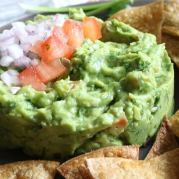 Chunky Guacamole is full of delicious flavors and textures. It's naturally gluten free and is a great dip for Paleo, GAPS or Whole30. Or enjoy with super easy homemade baked tortilla chips.