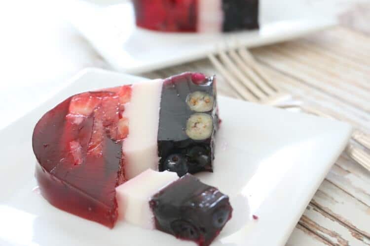 Perfectly layered with seasonal berries, this Real Food Patriotic "Jello" Cake contains gut-healing gelatin and natural sweetener. This popular summer treat is healthy with simple ingredients. It also happens to be Paleo, GAPS diet and even AIP!