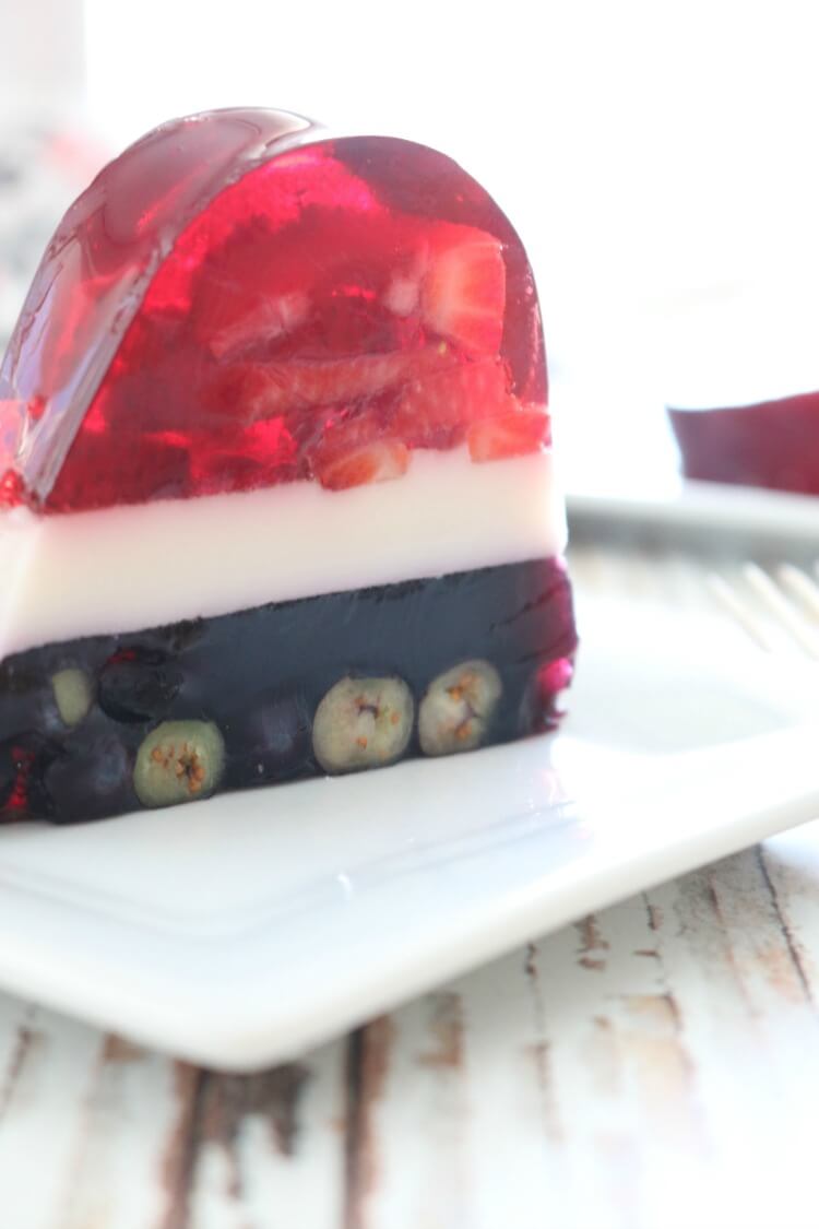 Perfectly layered with seasonal berries, this Real Food Patriotic "Jello" Cake contains gut-healing gelatin and natural sweetener. This popular summer treat is healthy with simple ingredients. It also happens to be Paleo, GAPS diet and even AIP!