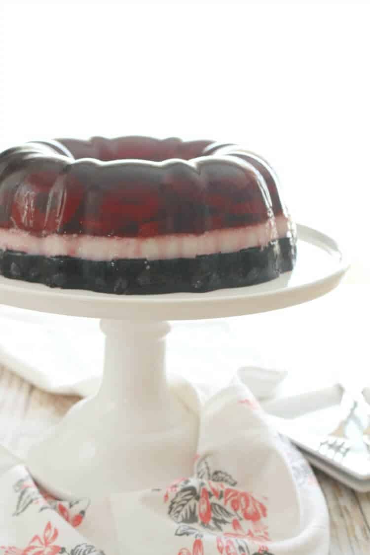 Perfectly layered with seasonal berries, this Real Food Patriotic "Jello" Cake contains gut-healing gelatin and natural sweetener. This popular summer treat is healthy with simple ingredients. It also happens to be Paleo, Whole30, GAPS diet and even AIP!