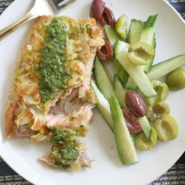 Almond Crusted Trout with Chermoula and Cucumber Olive Salad - This naturally gluten free meal can be brought together in 40 minutes. Delicious and complete meal that is paleo and whole30.