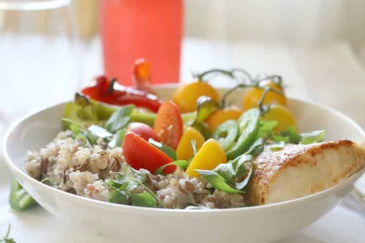 Mahi Mahi on Sprouted Grains Bowl -Oven-baked and paprika-seasoned Mahi Mahi fillets on a bed of sprouted grains, roasted bell peppers and drizzled with Lime-Yogurt Dressing makes for an easy weeknight meal or special dinner.