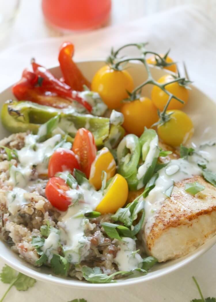Mahi Mahi on Sprouted Grains Bowl -Oven-baked and paprika-seasoned Mahi Mahi fillets on a bed of sprouted grains, roasted bell peppers and drizzled with Lime-Yogurt Dressing makes for an easy weeknight meal or special dinner.