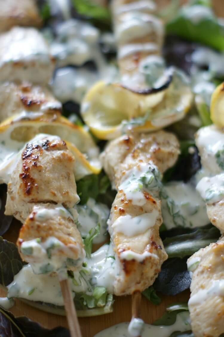 Coriander Chicken Kebabs with Cilantro Kefir Sauce - Tender and juicy, these oven-baked Coriander Chicken Kebabs are perfect on a bed of rice (or greens for low-carb) and topped with Cilantro Kefir Sauce for extra probiotics and flavor. Gluten Free | Primal | Cultured | GAPS diet