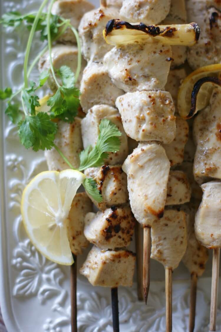 Coriander Chicken Kebabs with Cilantro Kefir Sauce - Tender and juicy, these oven-baked Coriander Chicken Kebabs are perfect on a bed of rice (or greens for low-carb) and topped with Cilantro Kefir Sauce for extra probiotics and flavor. Gluten Free | Primal | Cultured | GAPS diet