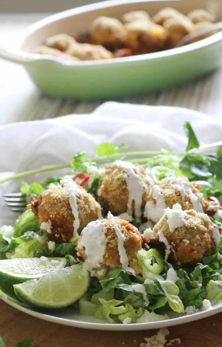 Turkey Fajita Meatballs - #ad Tender and flavorful from the onions and bell peppers, these Turkey Fajita Meatballs are quick and easy to put together for an lazy weeknight meal. Enjoy on a bed of romaine lettuce (or rice!) drizzled with crema fresca and topped with Cotija cheese.