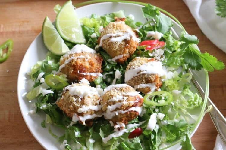 Turkey Fajita Meatballs - #ad Tender and flavorful from the onions and bell peppers, these Turkey Fajita Meatballs are quick and easy to put together for an lazy weeknight meal. Enjoy on a bed of romaine lettuce (or rice!) drizzled with crema fresca and topped with Cotija cheese.