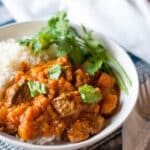 Lamb and Butternut Squash Curry made in the electric pressure cooker (Instant Pot) starts with tender grass-fed lamb, diced butternut squash, creamy coconut milk, and loads of curry flavor. Naturally #paleo, #whole30, and #GAPS for optimal nutrition. #instantpot #cleaneating
