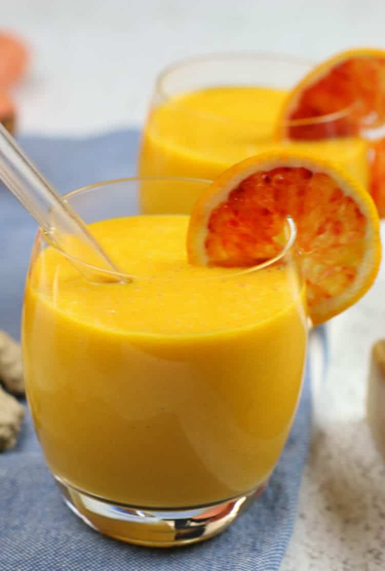 Immune Boosting Citrus Ginger Smoothie - Sweet citrus fruits are blended with carrots, ginger, turmeric, and a bit of coconut oil for healthy fats. Add in additional whole foods vitamin C for an extra boost.  #immuneboosting #healthysmoothie #citrus #ginger