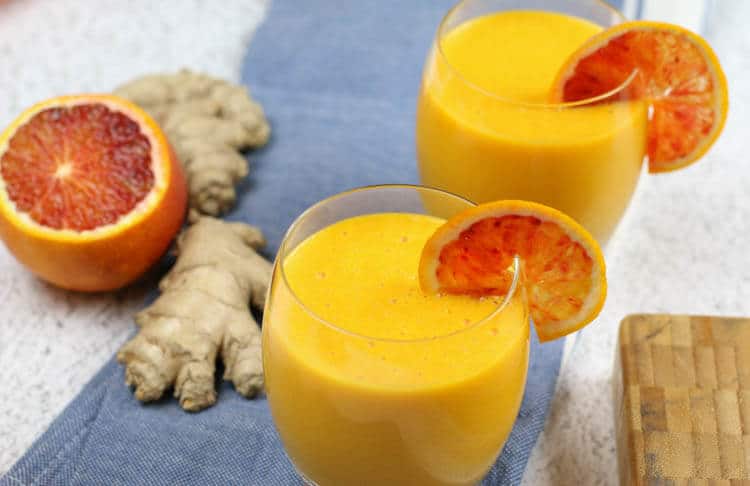 Immune Boosting Citrus Ginger Smoothie - Sweet citrus fruits are blended with carrots, ginger, turmeric, and a bit of coconut oil for healthy fats. Add in additional whole foods vitamin C for an extra boost.  #immuneboosting #healthysmoothie #citrus #ginger