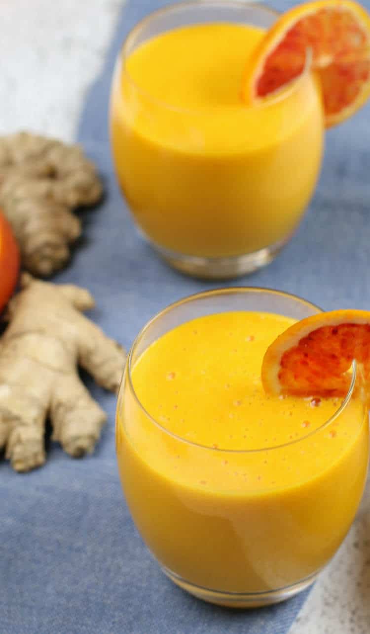 Immune Boosting Citrus Ginger Smoothie - Sweet citrus fruits are blended with carrots, ginger, turmeric, and a bit of coconut oil for healthy fats. Add in additional whole foods vitamin C for an extra boost.  #immuneboosting #healthysmoothie #citrus #ginger