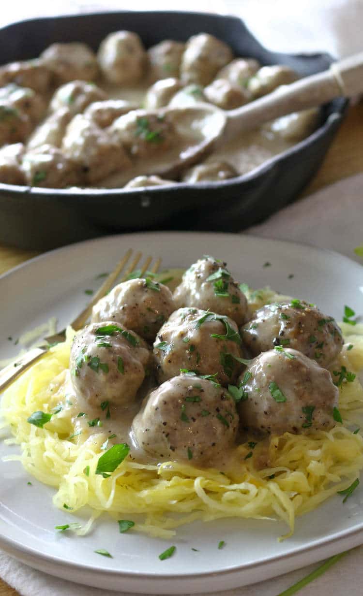 Oven-Baked Swedish Meatballs (Paleo, Whole30) - These Paleo Swedish Meatballs are just as satisfying as the original comfort food but without the gluten or dairy. They come together easily, baked to perfection in the oven, and then smothered in the delicious gluten-free gravy. #whole30 #meatballs 