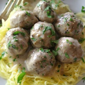 Oven-Baked Swedish Meatballs (Paleo, Whole30) - These Paleo Swedish Meatballs are just as satisfying as the original comfort food but without the gluten or dairy. They come together easily, baked to perfection in the oven, and then smothered in the delicious gluten-free gravy. #whole30 #ovenbaked