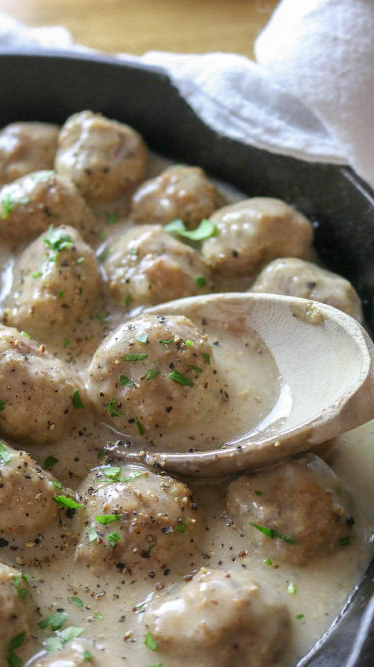 Oven-Baked Swedish Meatballs (Paleo, Whole30) - These Paleo Swedish Meatballs are just as satisfying as the original comfort food but without the gluten or dairy. They come together easily, baked to perfection in the oven, and then smothered in the delicious gluten-free gravy. #whole30 #ovenbaked