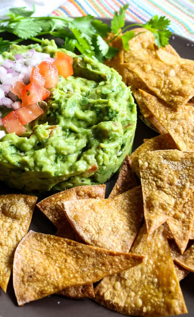 How to Make Healthy Tortilla Chips - 2 Ingredients! Check out how easy it is to make healthy, homemade tortillas that requires only 2 ingredients and 15 minutes of your time. Great to dip into chunky guacamole or pico de gallo. #homemadechips #tortillachips