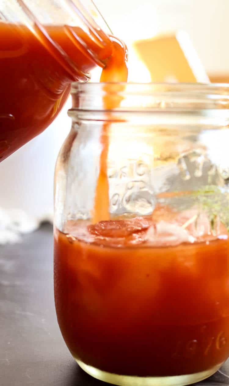 How to Make Homemade Tomato Juice from Tomato Paste -Did you know you can easily make tomato juice out of tomato paste?  This easy homemade tomato juice recipe calls for sea salt and healthy fats for better nutrient absorption. It's naturally Paleo, Whole30, and GAPS compliant. #tomatojuice #homemade #paleo 