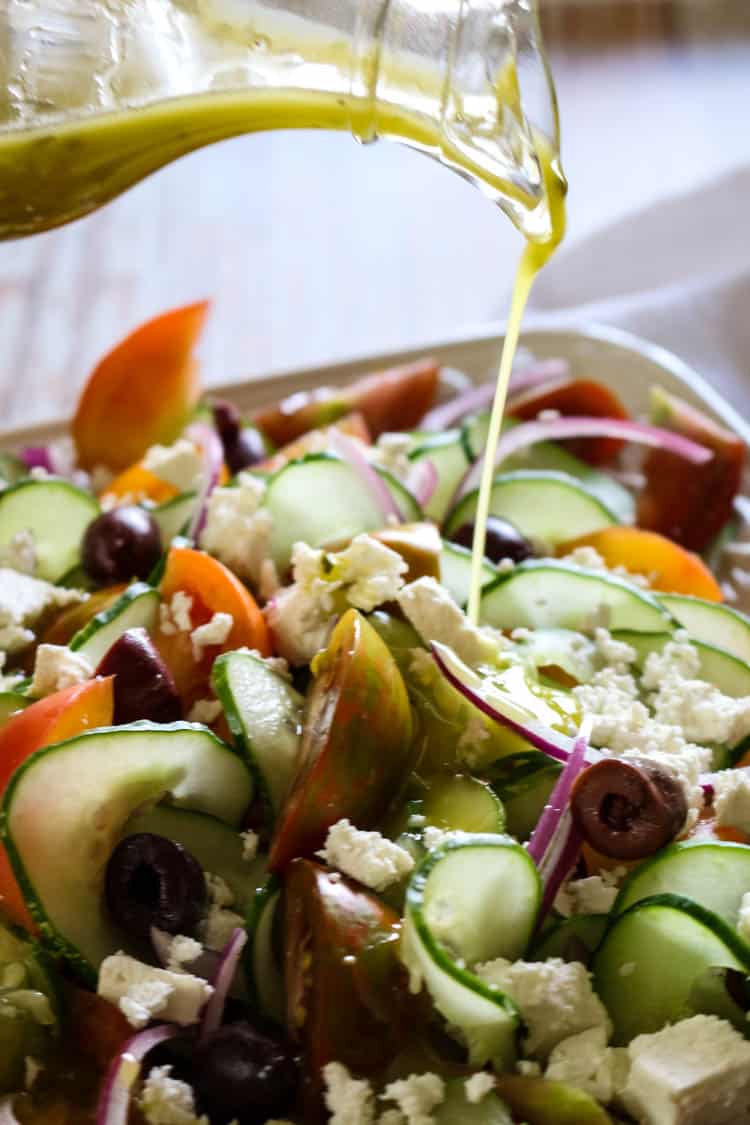 Greek Tomato & Cucumber Salad (Low Carb, Primal, GAPS) -This Greek Tomato and Cucumber Salad with or without feta cheese has all the robust Mediterranean flavors. With a simple 4-ingredient salad dressing, this salad can be made in 15 minutes. #healthysalad #greeksalad 