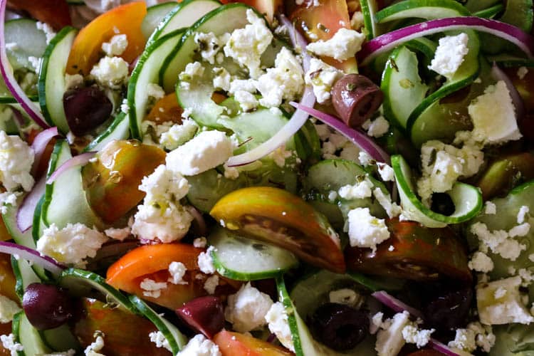 Greek Tomato & Cucumber Salad (Low Carb, Primal, GAPS) -This Greek Tomato and Cucumber Salad with or without feta cheese has all the robust Mediterranean flavors. With a simple 4-ingredient salad dressing, this salad can be made in 15 minutes. #healthysalad #greeksalad 