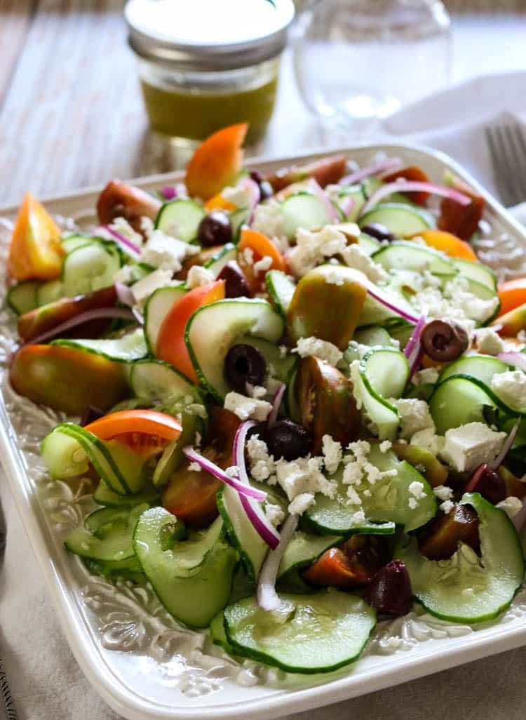 Greek Tomato & Cucumber Salad (Low Carb, Primal, GAPS) -This Greek Tomato and Cucumber Salad with or without feta cheese has all the robust Mediterranean flavors. With a simple 4-ingredient salad dressing, this salad can be made in 15 minutes. #healthysalad #greeksalad