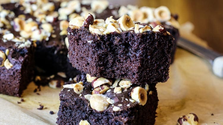 Brownies made with coconut flour and hazelnuts on top.