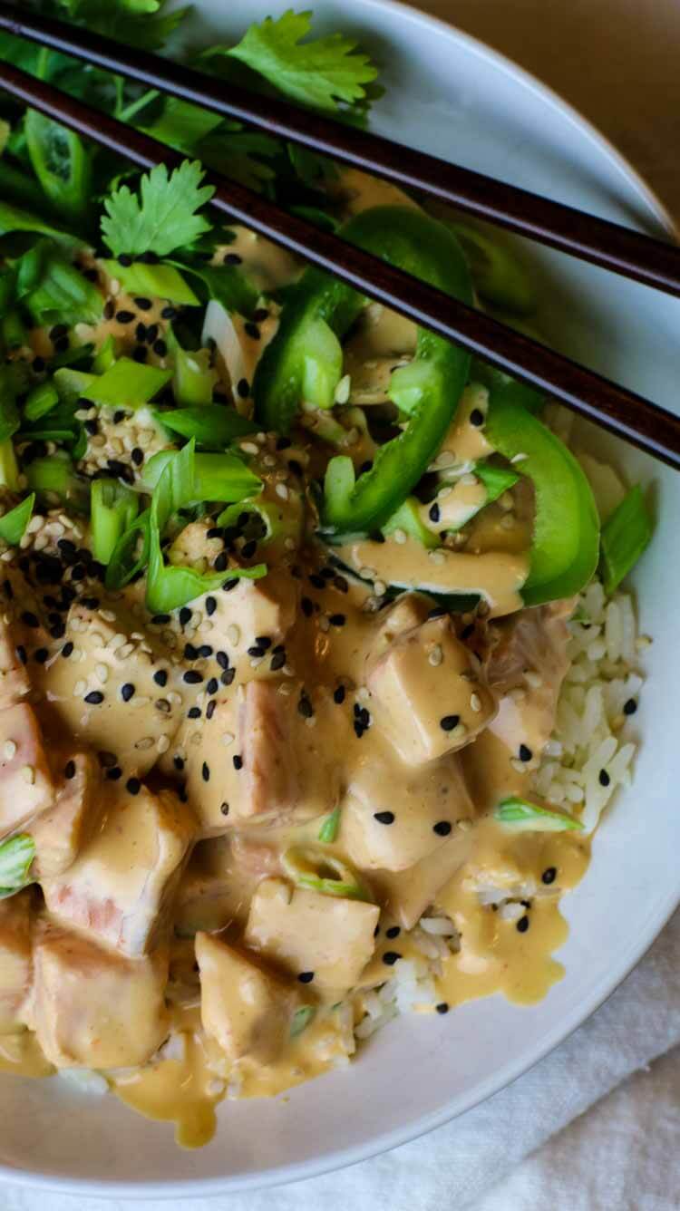 Salmon poke in a creamy sauce with jalapenos, cilantro and green onions.