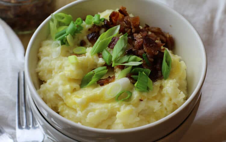 Mashed potatoes loaded with bacon and scallions and lots of cheese.