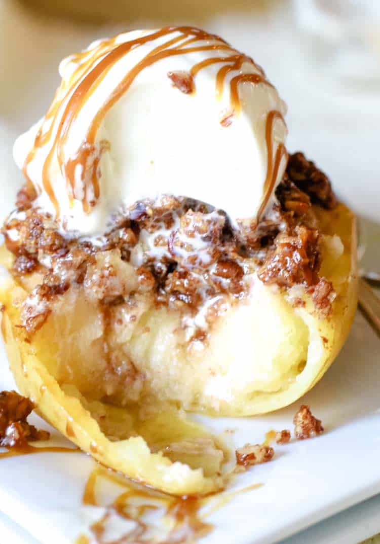 Baked apple half with melted ice cream.