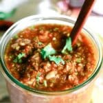 Blender salsa in a weck jar with wooden spoon