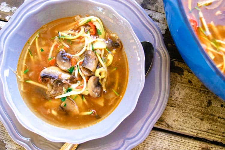 Bowl of healthy vegetable soup with mushrooms, potatoes and carrots