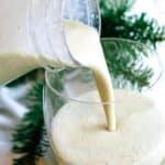 Eggnog poured from bottle into a glass