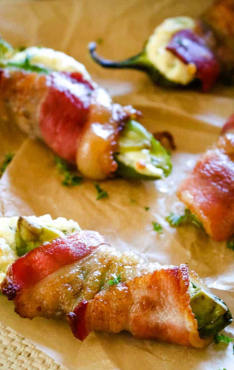 Jalapeno peppers with cream cheese, cheddar cheese and wrapped with bacon