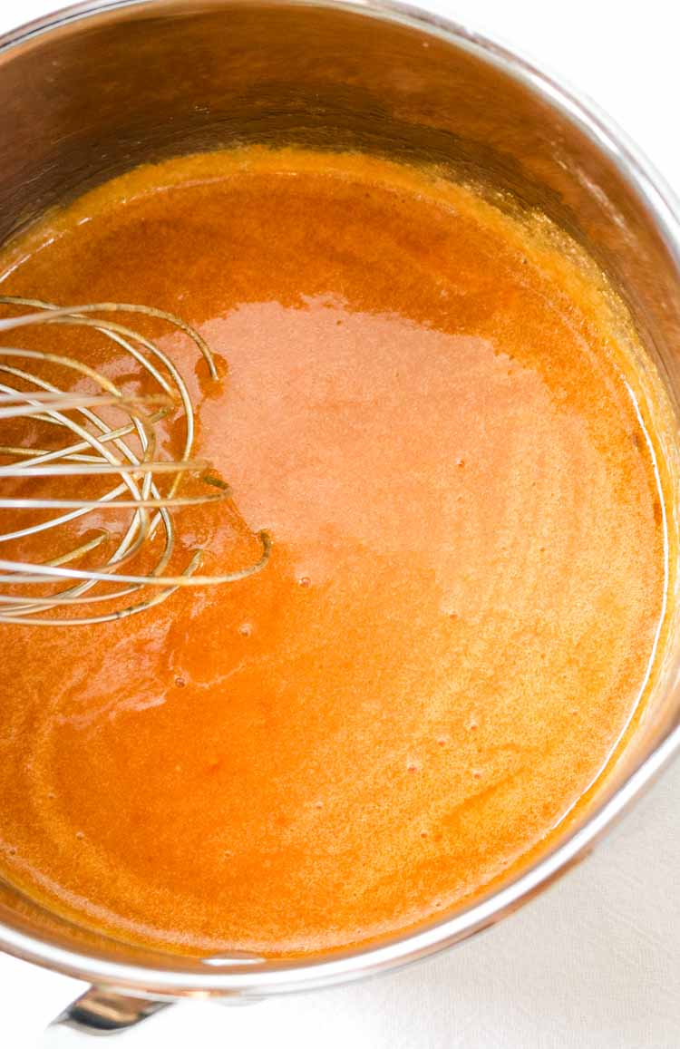 Whisked butter, hot sauce and honey to make Buffalo Wing Sauce