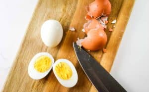 Peeled eggs are cut lengthwise
