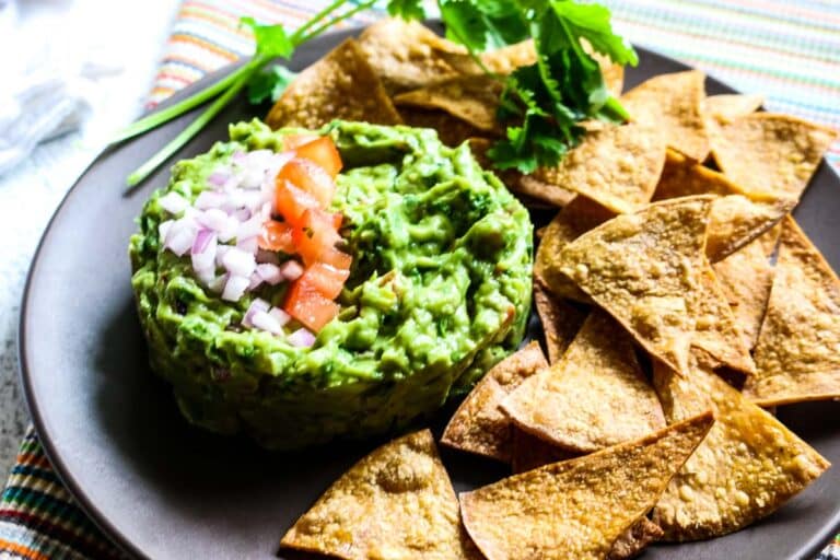 plate of tortilla chips with guacamole