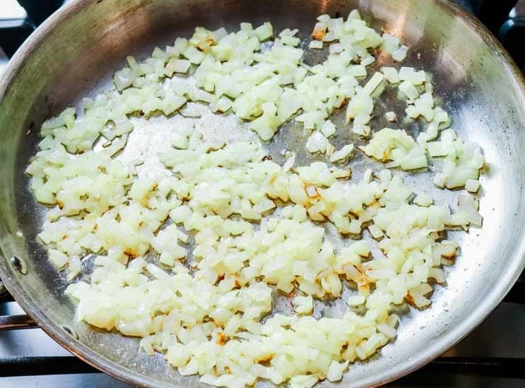 browned diced yellow onions on pan