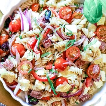 pasta salad with tomatoes, olives, red onions