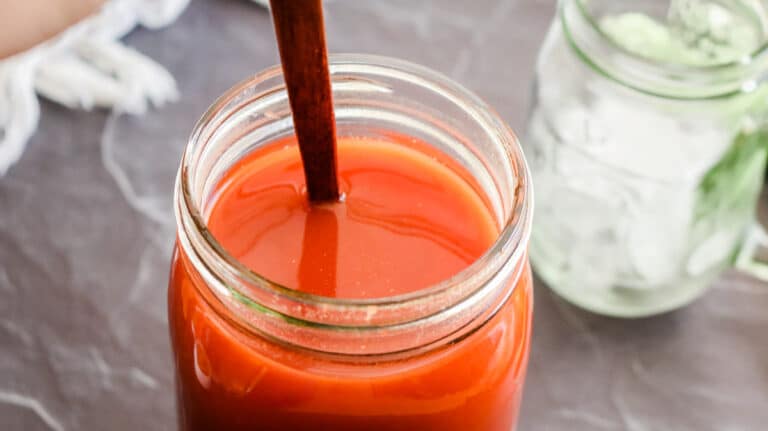Dissolving tomato paste in water for tomato juice