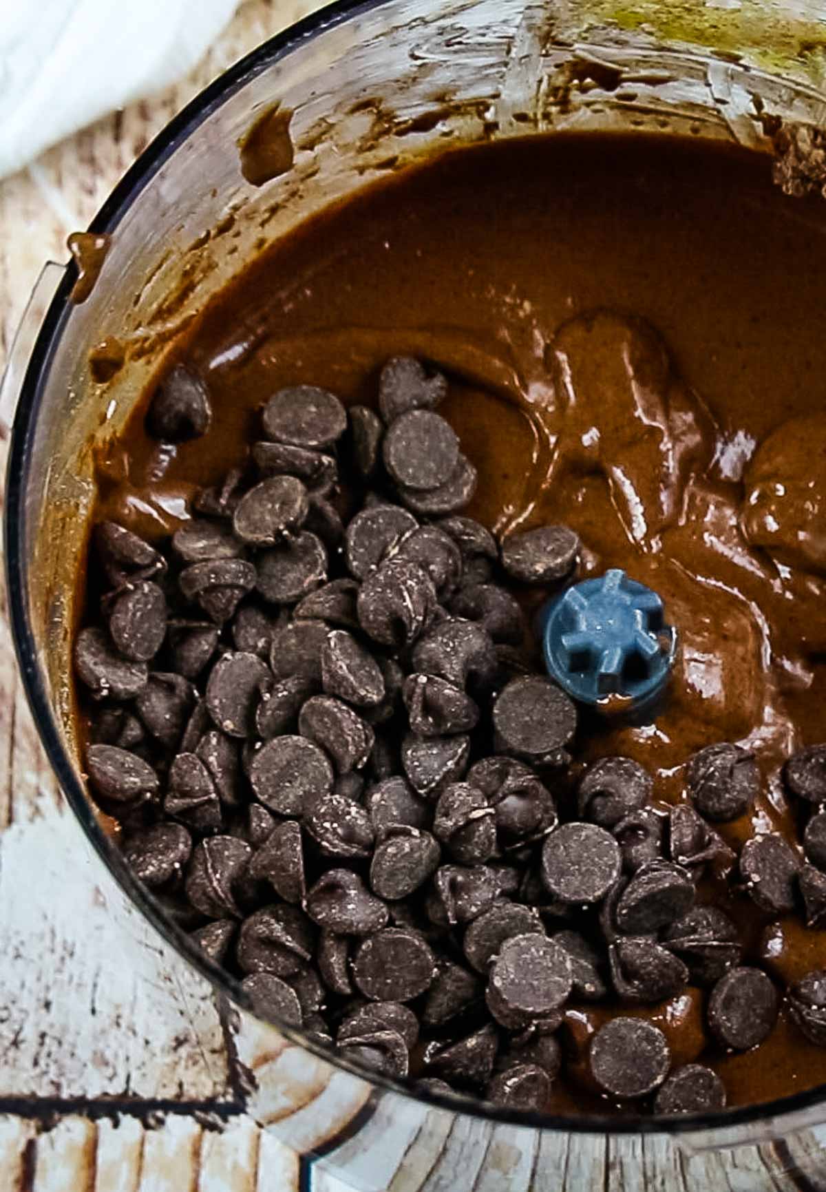 chocolate chips in chocolate batter in food processor