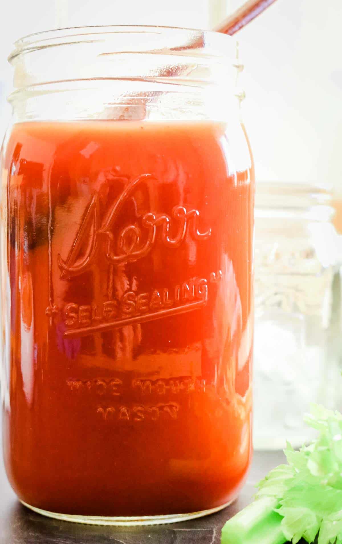 homemade tomato juice in large quart mason jar