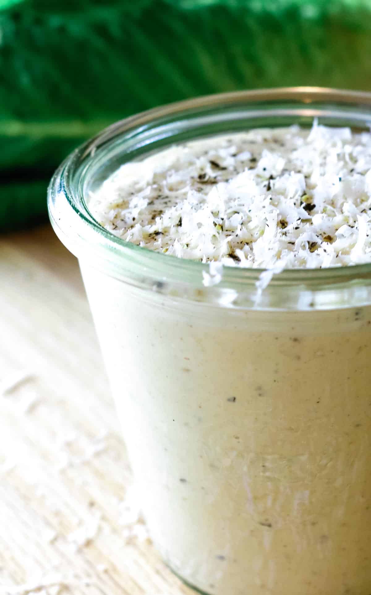 Caesar salad dressing with cracked black pepper and parmesan