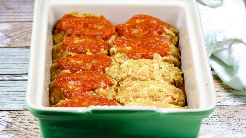 lazy cabbage rolls in a baking dish with tomato sauce