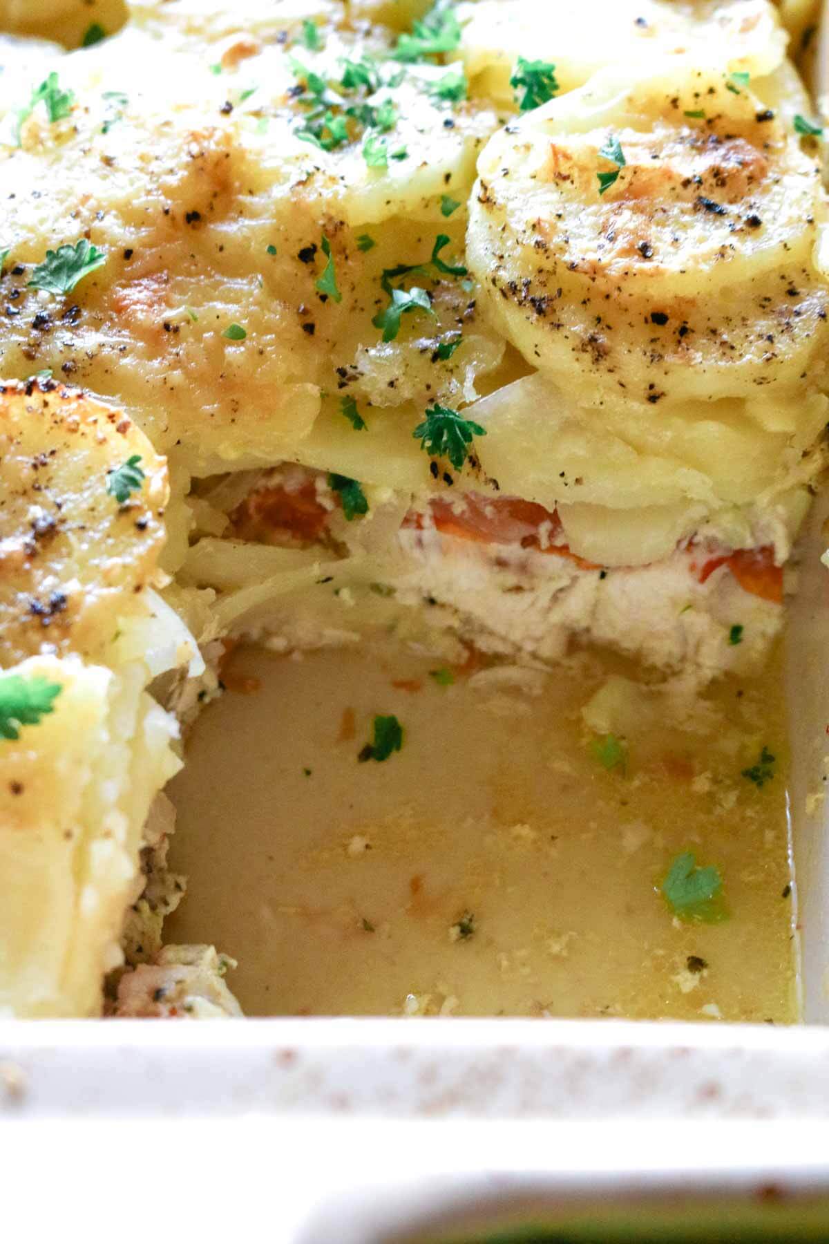 chicken and potato dish with missing cut of casserole