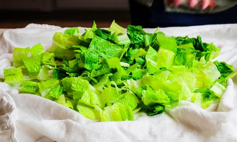 chopped romaine lettuce on white towel