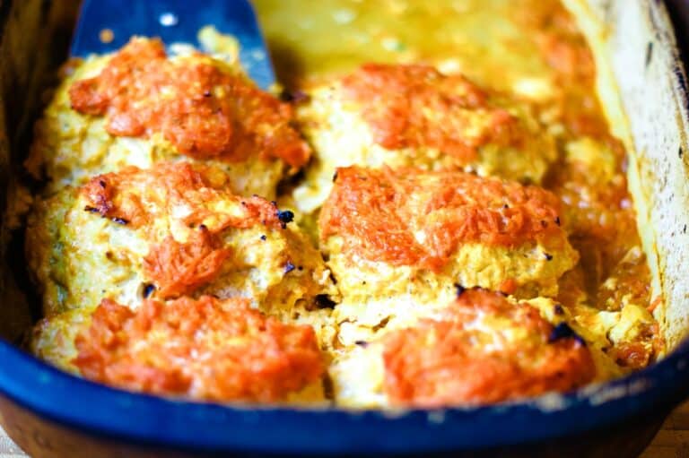 freshly baked cabbage rolls in a casserole dish