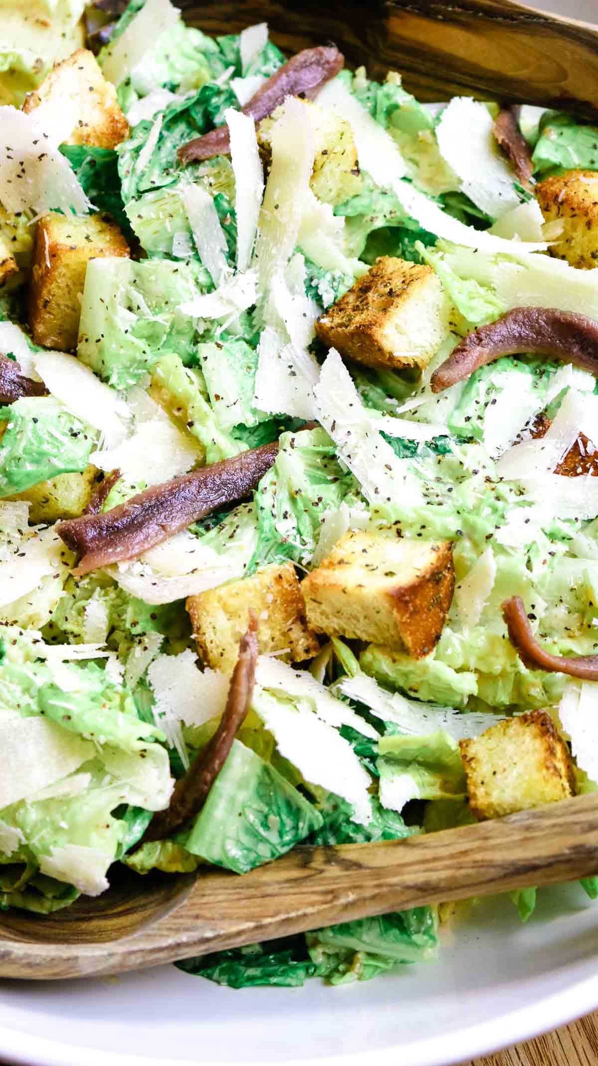 upclose photo of romain lettuce, croutons and anchovies