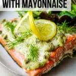 text overlay over a picture of salmon with mayo and topped with lemon slice.